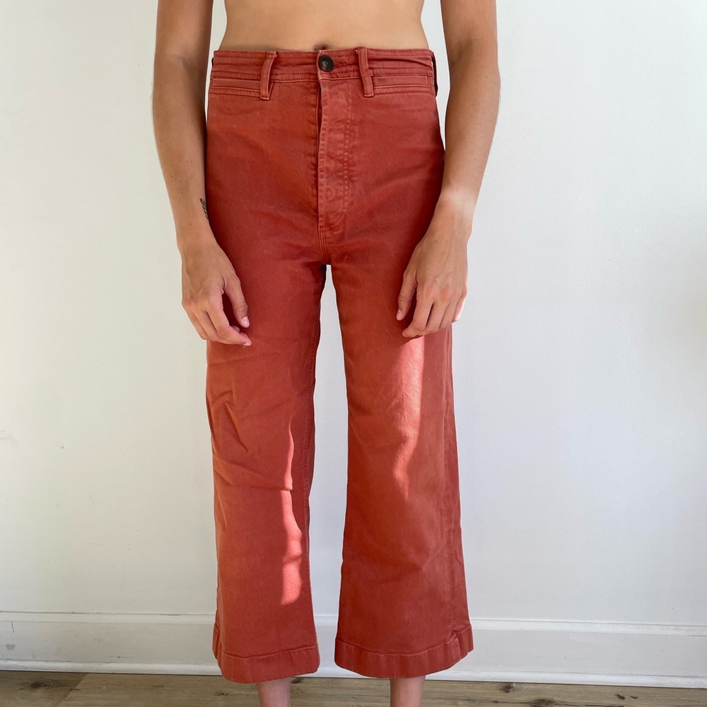 Wide leg button fly faded red denim pants